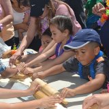 Rolling the dough for the giant pizza.